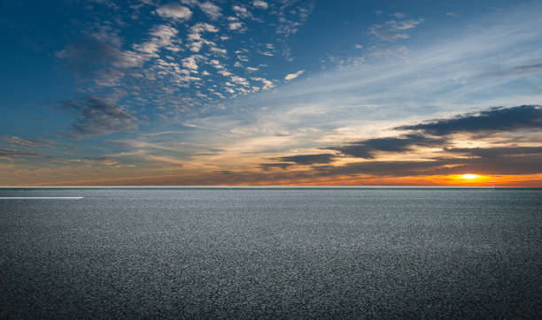 istock Evening glow, flat and wide asphalt road 1268185528
