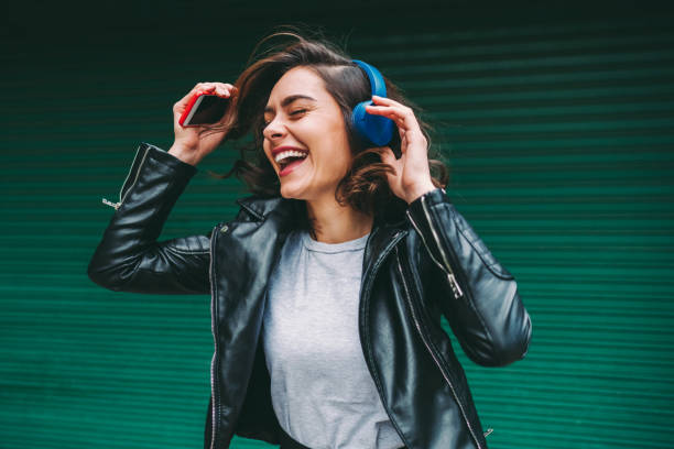 istock Millennial girl enjoying disco music 1268186130
