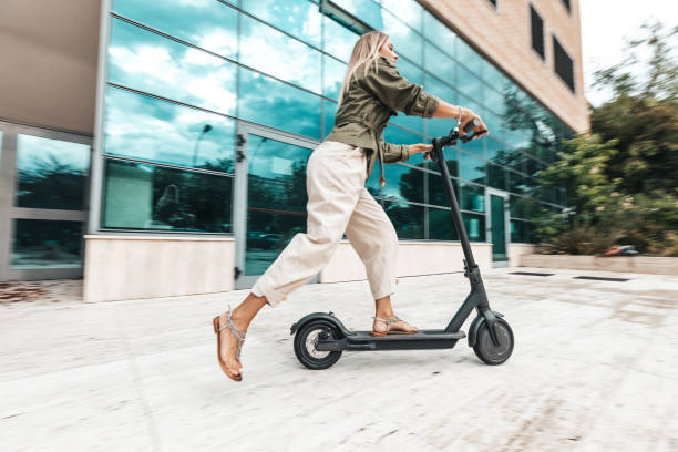 istock Green mobility in the city; woman commuting to work 1268186211