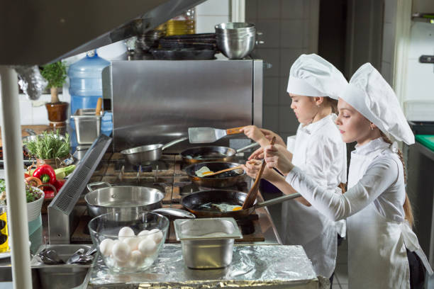 istock Children cook eggs in the kitchen at the Restaurant. 1268186432