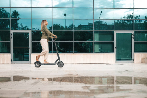 istock Green mobility in the city; woman commuting to work 1268186590