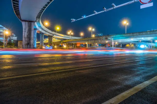 Photo of City road surface floor with viaduct bridge