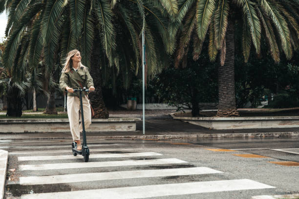 Green mobility in the city; woman commuting to work