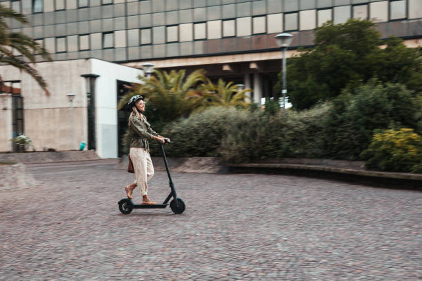 istock Green mobility in the city; woman commuting to work 1268188033