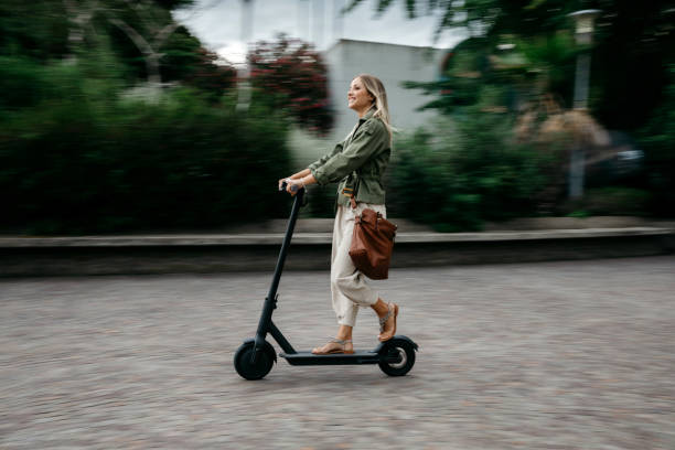 Green mobility in the city; woman commuting to work