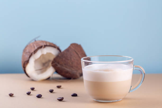 Cappuccino with coconut milk. Light blue background. Copy space.