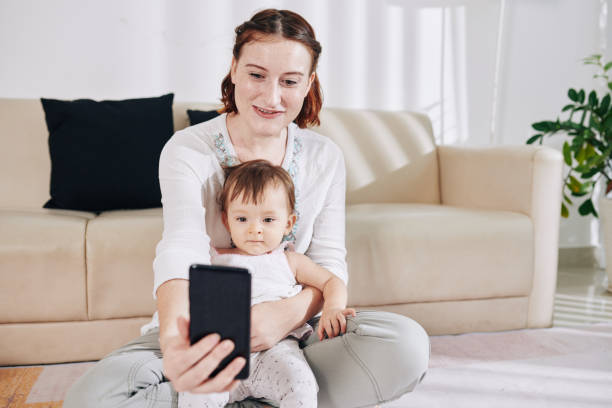 istock Mother photographing with daughter 1268197458