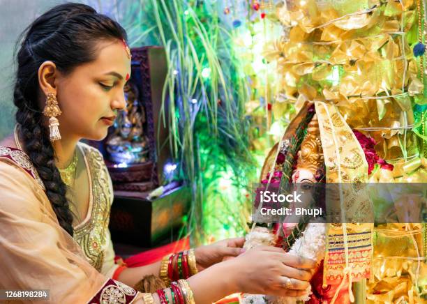 Happy Indian Young Woman Celebrating Ganesh Chaturthi Festival Stock Photo - Download Image Now