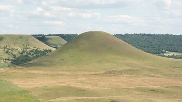 istock Beautiful smooth green hills on a Sunny summer day. 1268198510