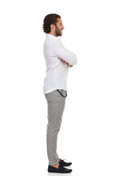 istock Side View Of Standing Elegant Man With Arms Crossed 1268201399