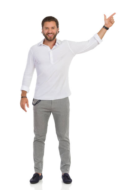 istock Handsome Man Is Standing With Arm Raised And Directing 1268201400