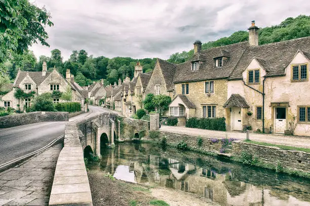 View of  historical village Castle Combe in Britain edited to look like an old postcard