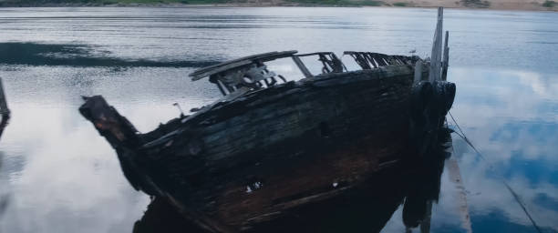 istock Rotten old wooden boat on shore. 1268206179