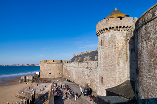 Saint Malo, France - June 09 2020: The Tour Quic-en-Groigne and the Tour des Dames, in the continuity of the ramparts of Saint-Malo, are two towers of the castle of Saint-Malo, which now houses the town hall and a museum.