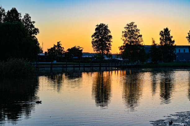 istock sunset over calm pond in silent park 1268208242