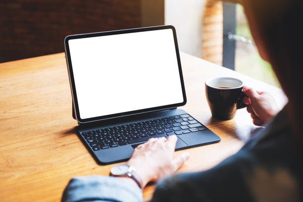istock a woman using and touching on digital tablet touchpad with blank white desktop screen as a computer pc 1268211284
