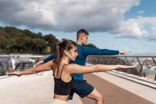 istock Man and woman making sport training outdoors together 1268216272