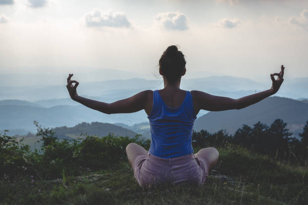 istock Woman practicing yoga in nature 1268223265