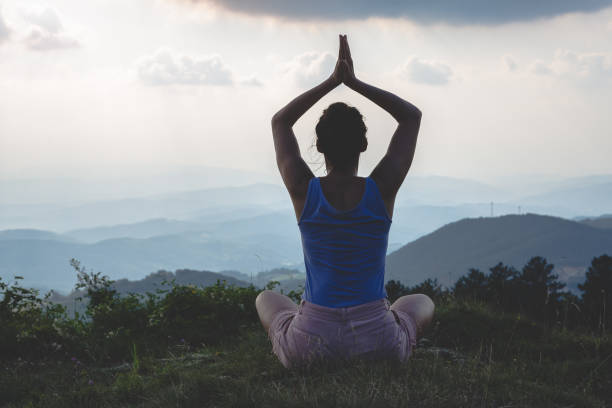 istock Woman practicing yoga in nature 1268223291