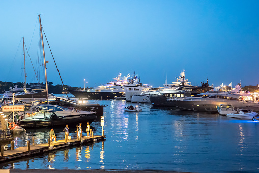Luxury yachts moored in Porto Cervo in the evening, Sardinia, Italy