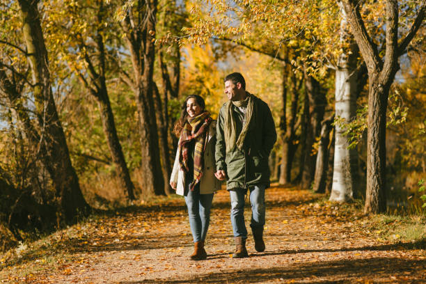 istock Cheerful couple strolling in autumn 1268226190