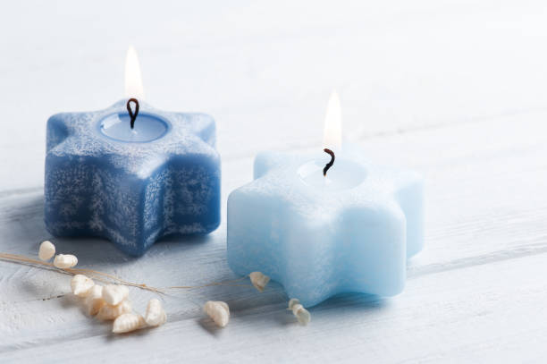 istock Two lit blue Christmas aroma candles 1268227202