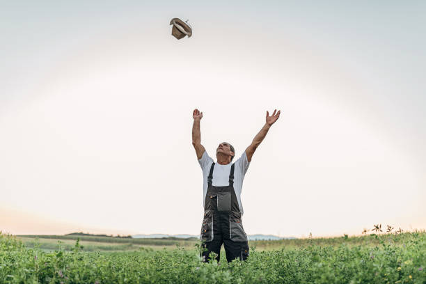 the farmer celebrates a good field