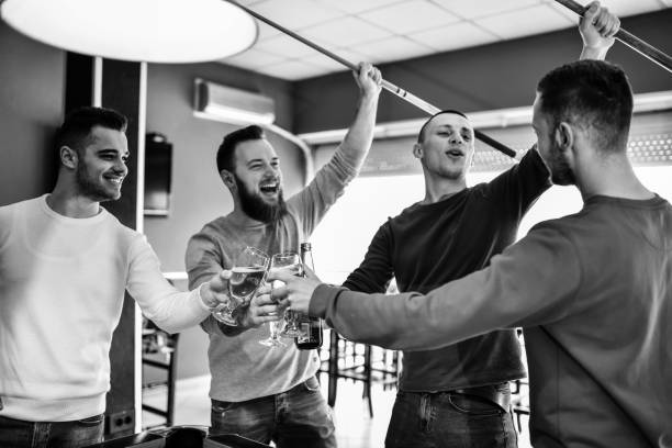 istock Friends Celebrating Snooker Victory 1268231285