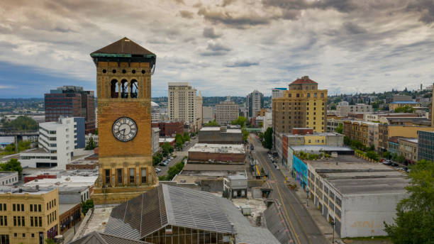 Aerial View Over The Old City Hall Clock Tower and Downtown Tacoma Washington An ominous sky cover the downtown area of Tacoma Washington tacoma stock pictures, royalty-free photos & images