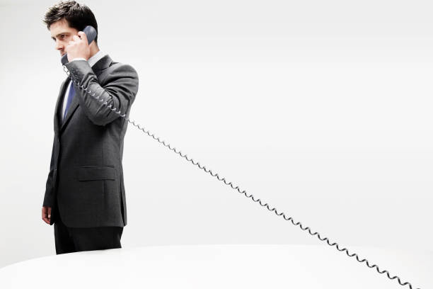 Businessman in a suit on Cord Telephone