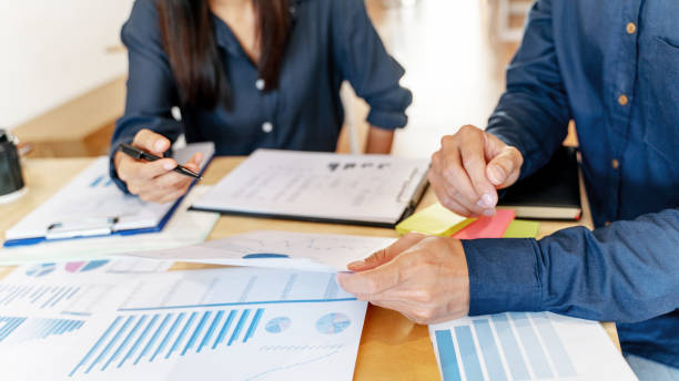 istock Two accountants working together with data documents of financial chart. 1268237356
