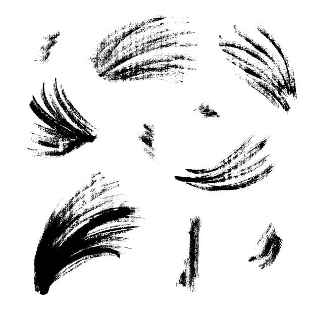 Collection of textured black ink brush strokes Collection of isolated vector textured black grunge wavy and splash ink brush strokes. Dirty hand drawn inky curve lines and blobs for graphic design, decoration eyeliner brush stock illustrations