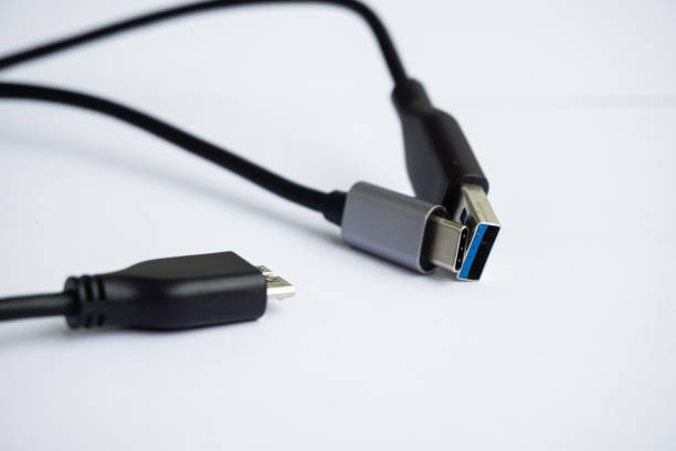 istock Detail of several usb cable plugs for transfering information isolated on white for background. Technology concept. 1268239003