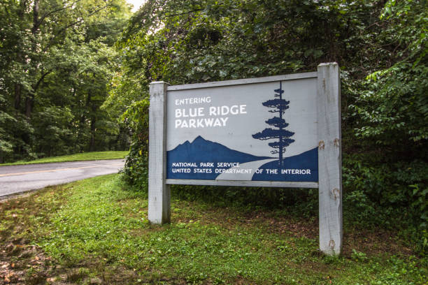 Entrance Sign To The Blue Ridge Parkway In North Carolina Cherokee, North Carolina, USA - August 14, 2020: Entrance sign to the Blue Ridge Parkway Scenic Byways in Cherokee. The parkway begins in the Great Smoky Mountains National Park and ends in Shenandoah National Park. blue ridge parkway stock pictures, royalty-free photos & images