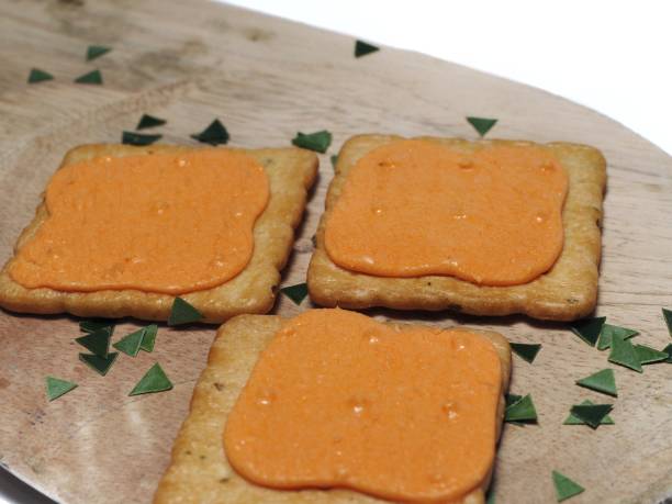 istock Sandwich crackers with cheese cream on wooden board. Top View. Flat Lay 1268240670