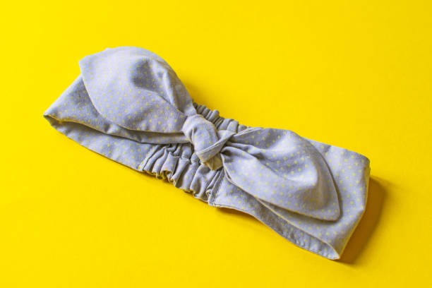 istock Cute gray children headband on a yellow background. 1268241850