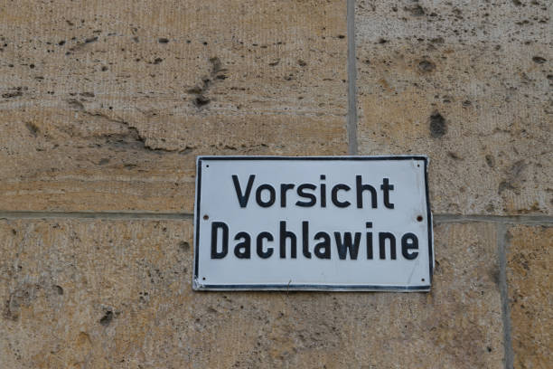 istock german sign means Be careful, roof avalanche 1268241853