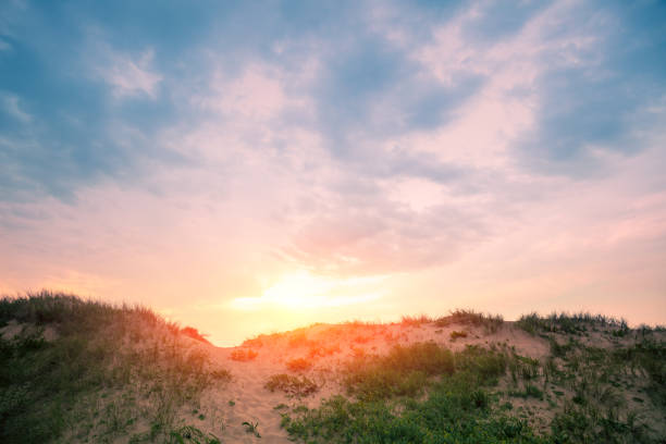 istock Sandy dune against evening sky. Nature landscape. Sandy hills on the beach 1268242264