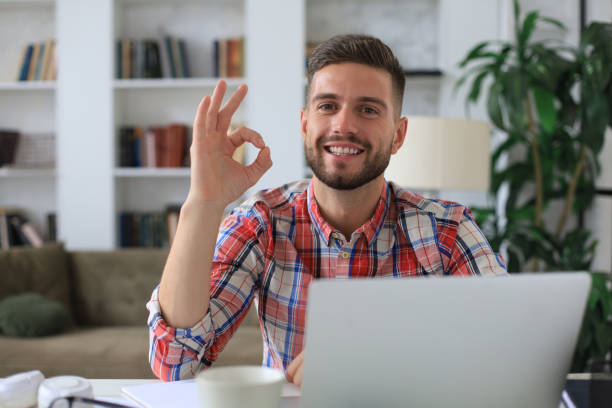 istock Smiling young business man having video call at home office. 1268243185