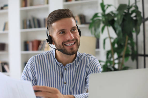 istock Smiling young business man having video call in office. 1268243338