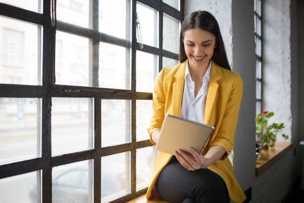 istock Beautiful young entrepreneur holding digital tablet 1268243530