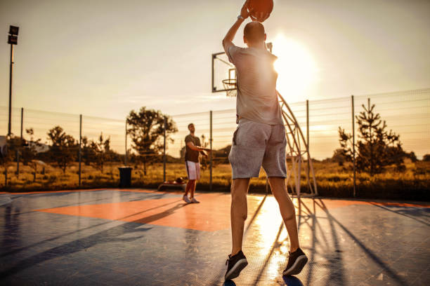 istock Basketball players playing outdoors 1268243683