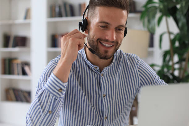 istock Smiling young business man having video call in office. 1268244576