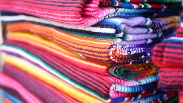 Colorful mexican wool serape blankets texture. Woven ornamental vivid textile with authentic latin american pattern. Striped multi colored fabric for poncho and sombrero. Hispanic indigenous style