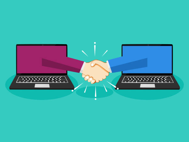 istock Business handshake through laptop. The concept of making deals online 1268245288