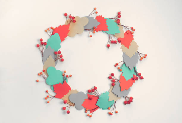 istock Autumn composition frame Paper colored leaves branches berries on white background The concept of autumn Flat lay top view 1268245890