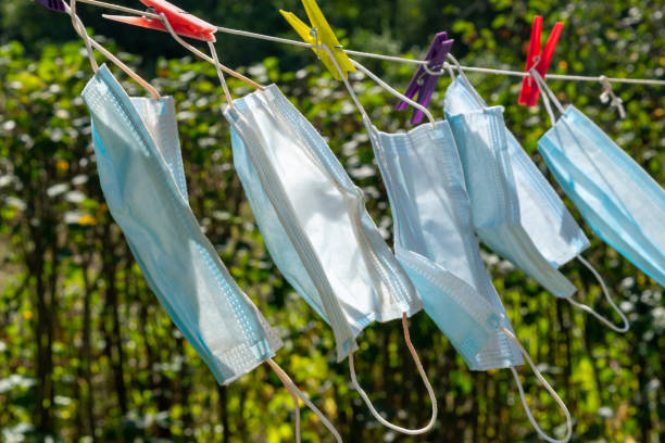 istock Used medicine masks hanging like laundry 1268247935