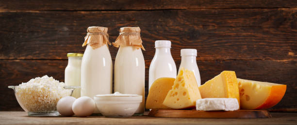 istock Dairy products : milk, cheese, cottage cheese, eggs, yogurt on a wooden background 1268252394
