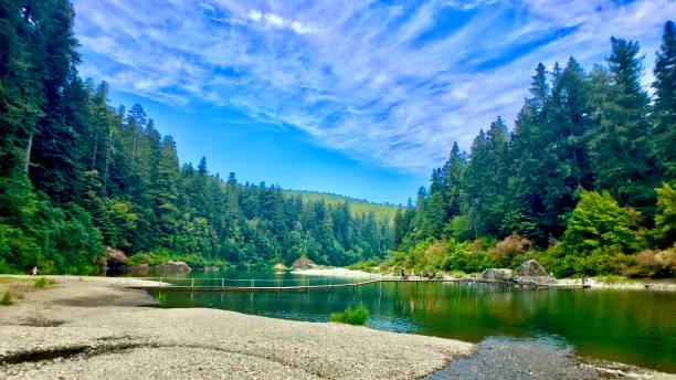 istock pedestrian footbridge stretching across the great smith river 1268252610