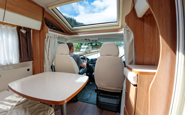 istock Man driving on a road in the Camper Van RV 1268255243